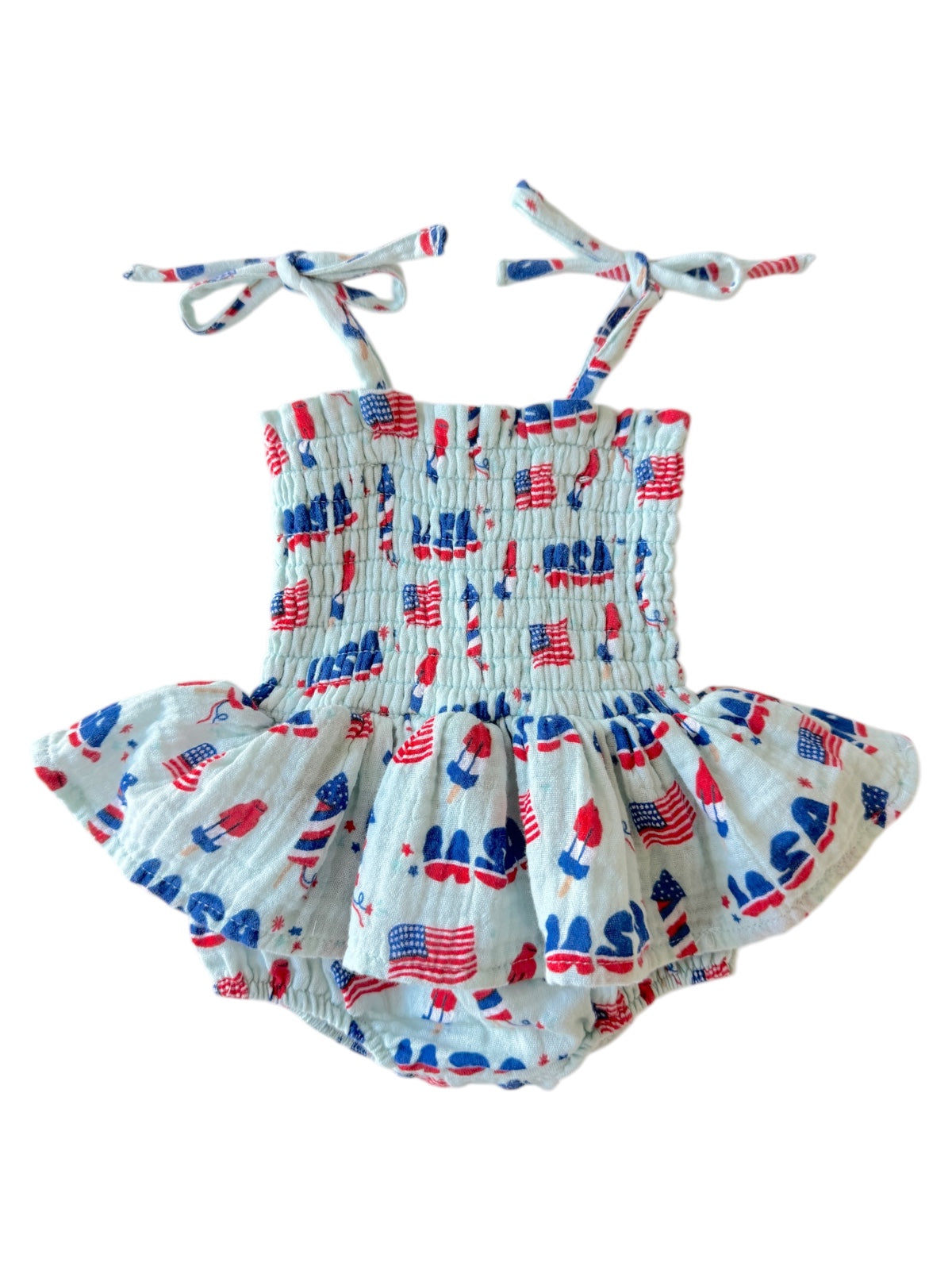 Blue and white toddler romper with red, white, and blue patterns of popsicles and flags.