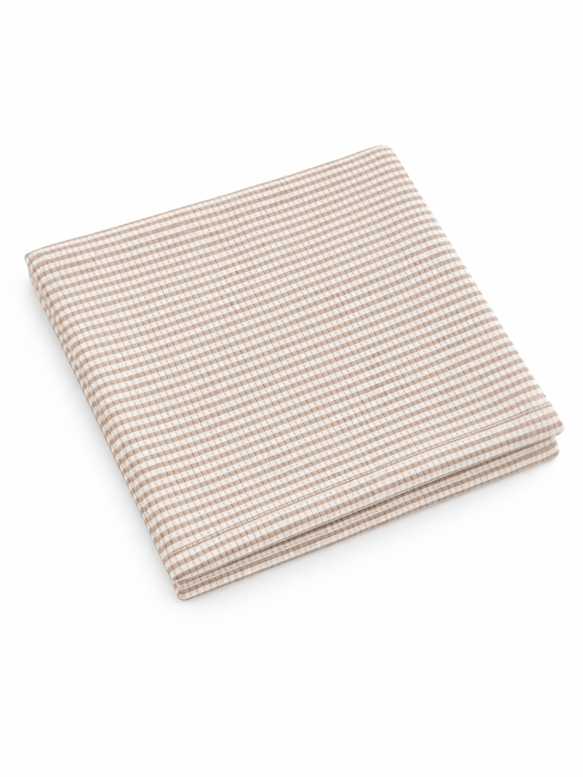 A folded beige and cream checkered fabric on a white background.