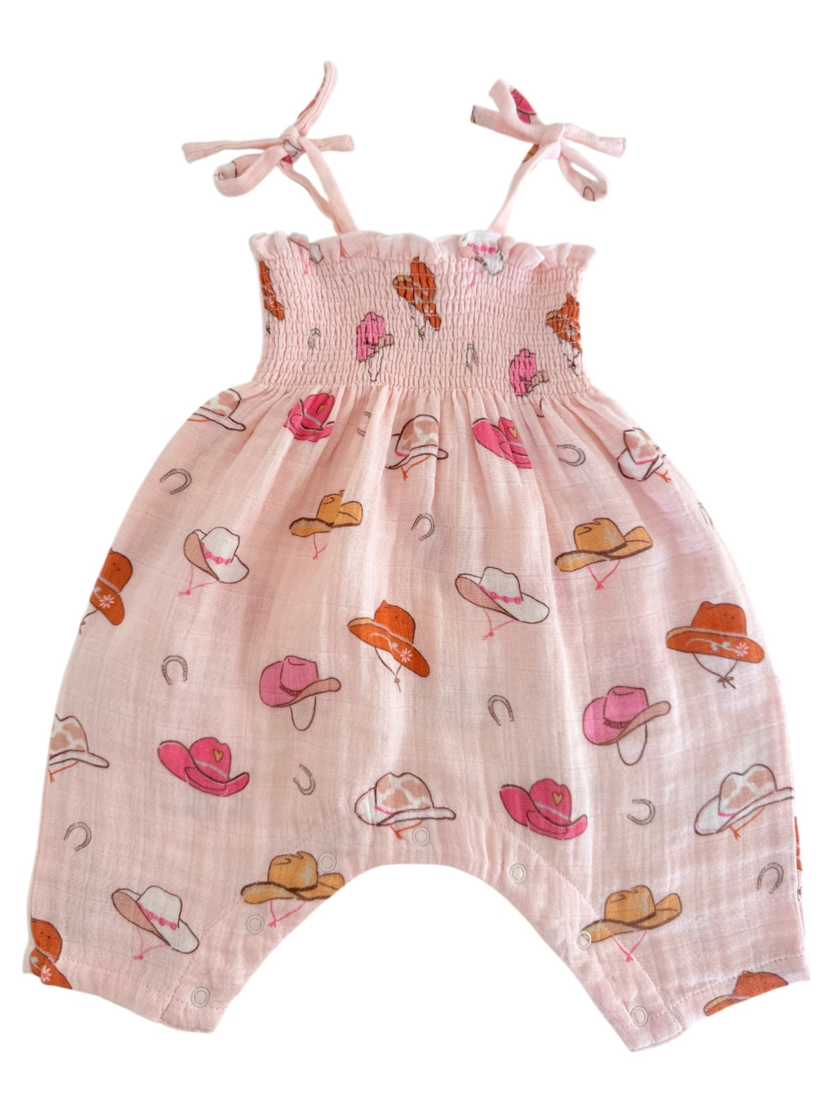 Pink toddler romper with a smocked bodice, adorned with colorful cowboy hats and playful designs.