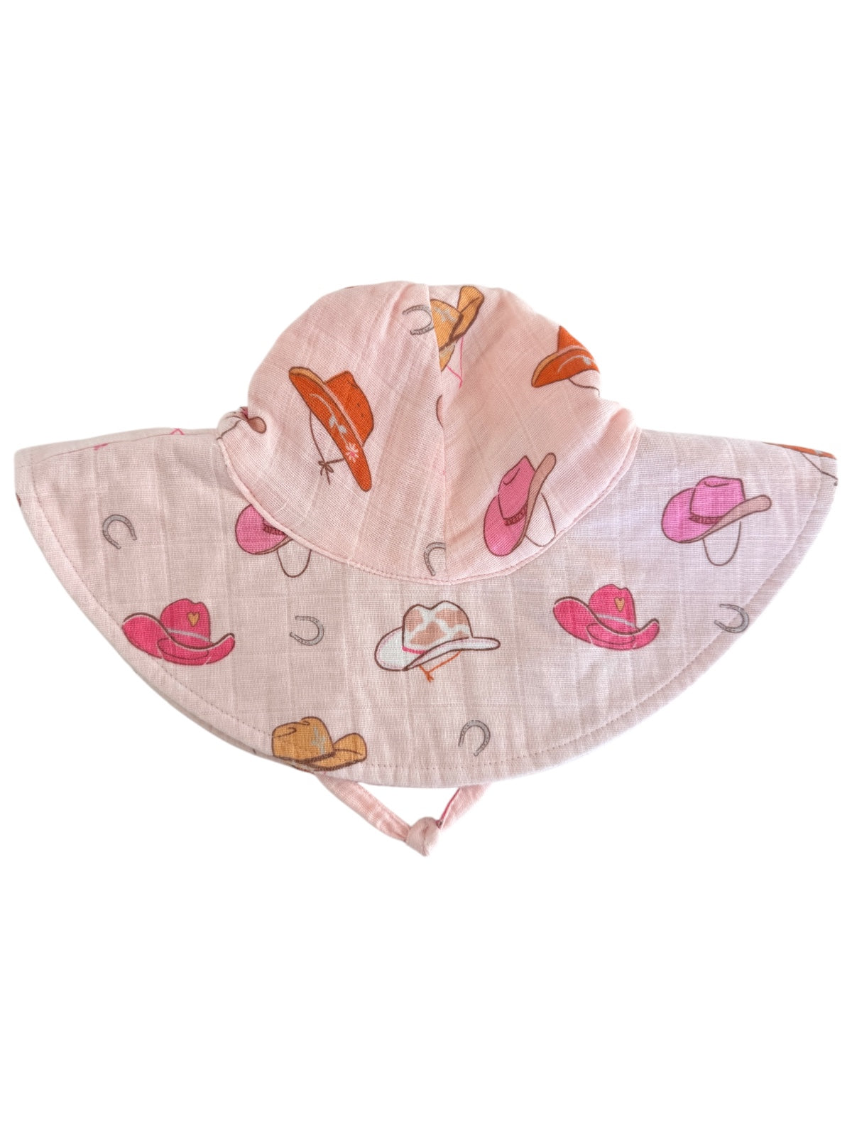 Pink sun hat with colorful cowboy hat patterns and a wide brim.