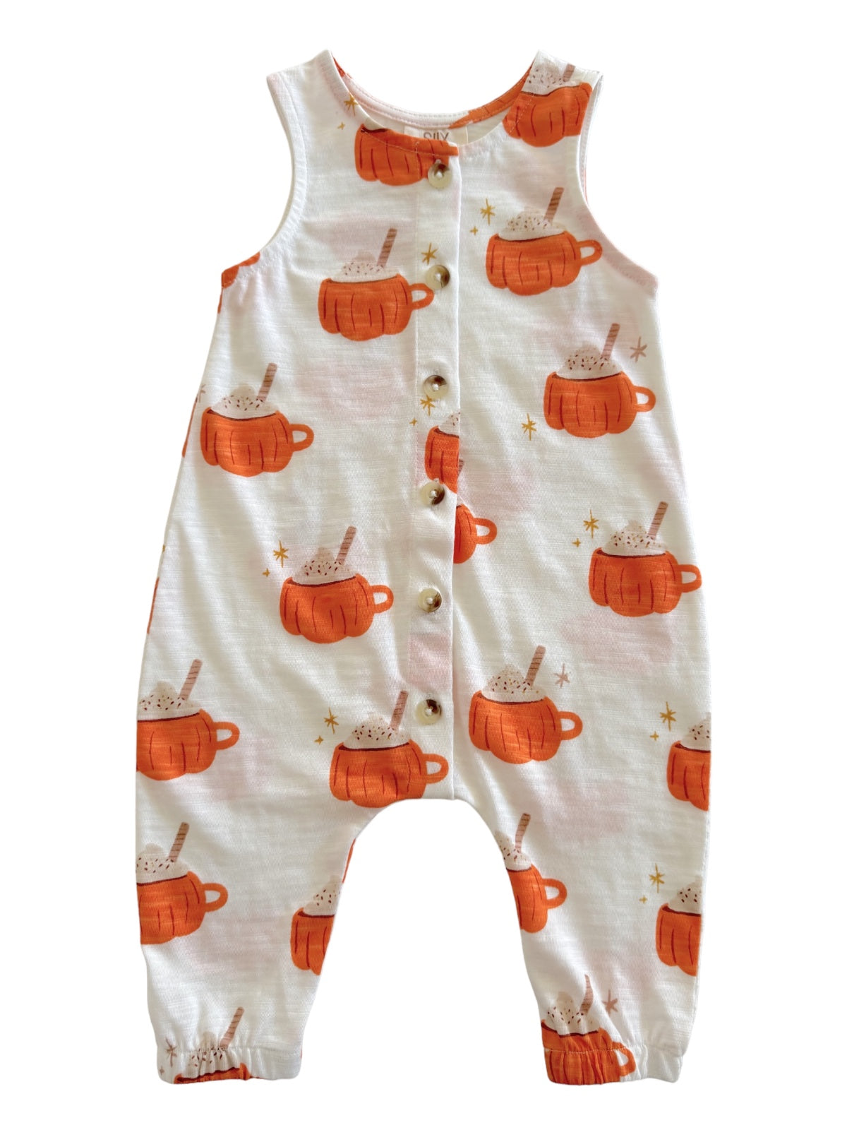 Child's romper featuring orange mug patterns with whipped cream and stars on a white background.