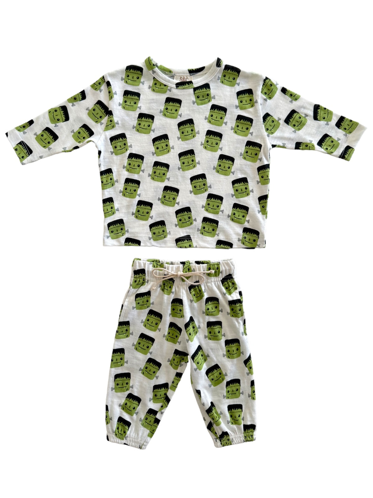 Kids' two-piece pajama set featuring a fun Frankenstein print in green and white, perfect for Halloween.