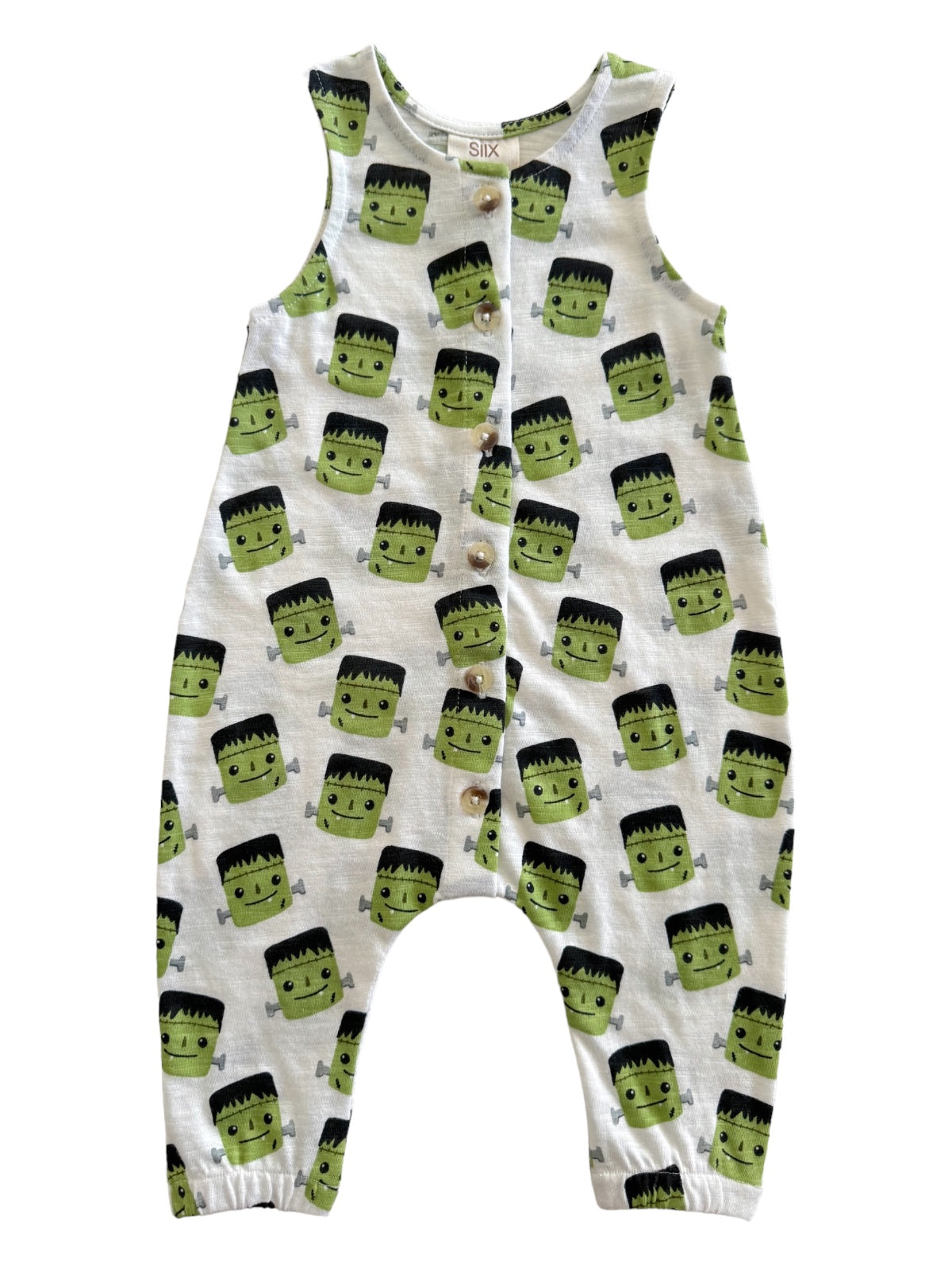Green monster-themed romper with button fastenings, featuring cartoonish faces on a light gray background.