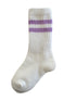 White socks with purple stripes, featuring ribbed texture and a crew style design.
