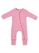 Light pink baby onesie with white floral pattern and a front zipper. Long sleeves and footed design.