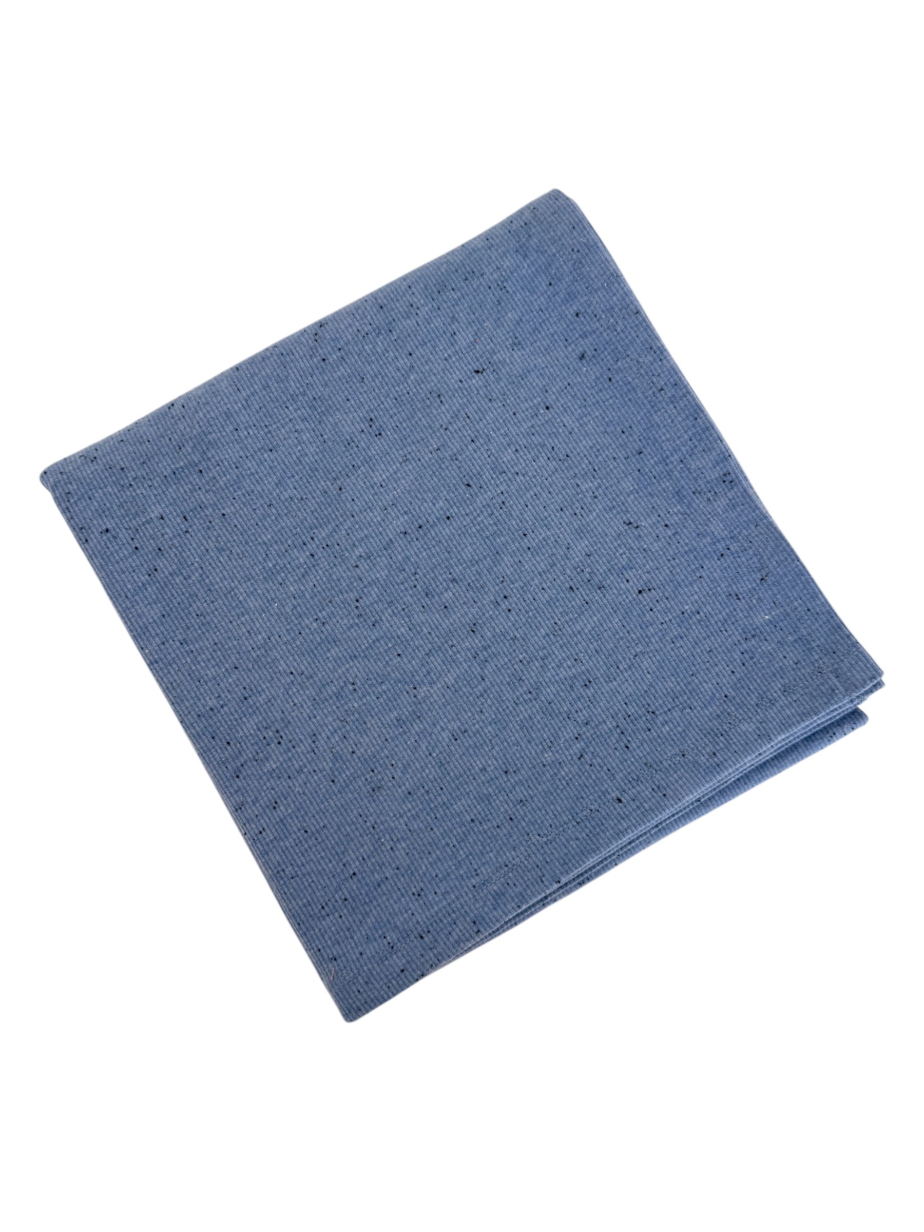 Folded blue cloth napkin with a textured surface and small black specks. Ideal for dining or decoration.