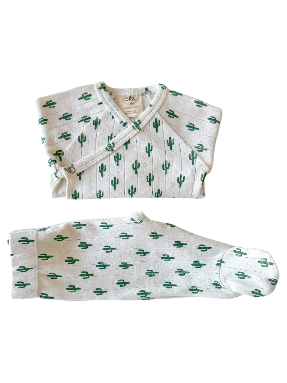 Infant outfit featuring a cactus pattern, including a top and matching pants. Ideal for 0-3 months.