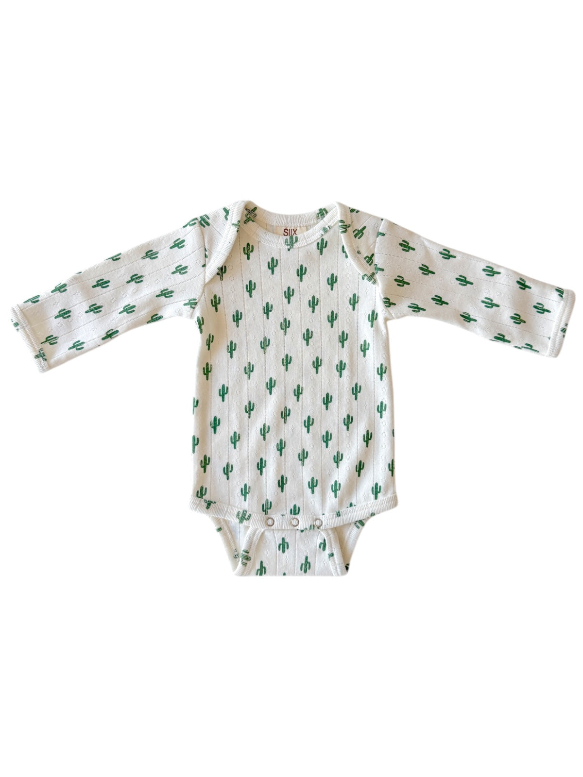 White baby onesie with green cactus pattern and long sleeves.