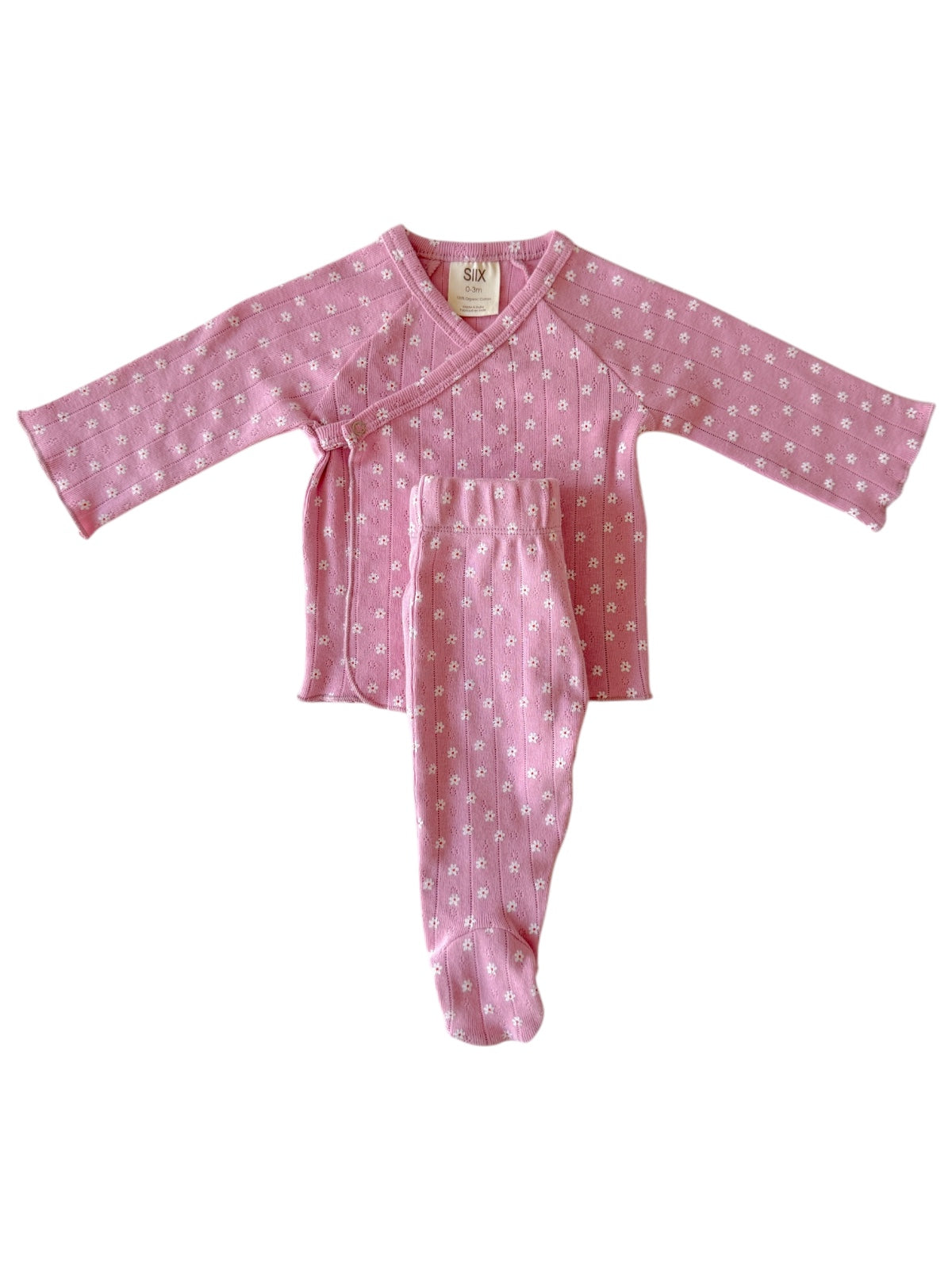Pink baby outfit with long sleeves and pants featuring a floral pattern. Soft, cozy fabric for infants.