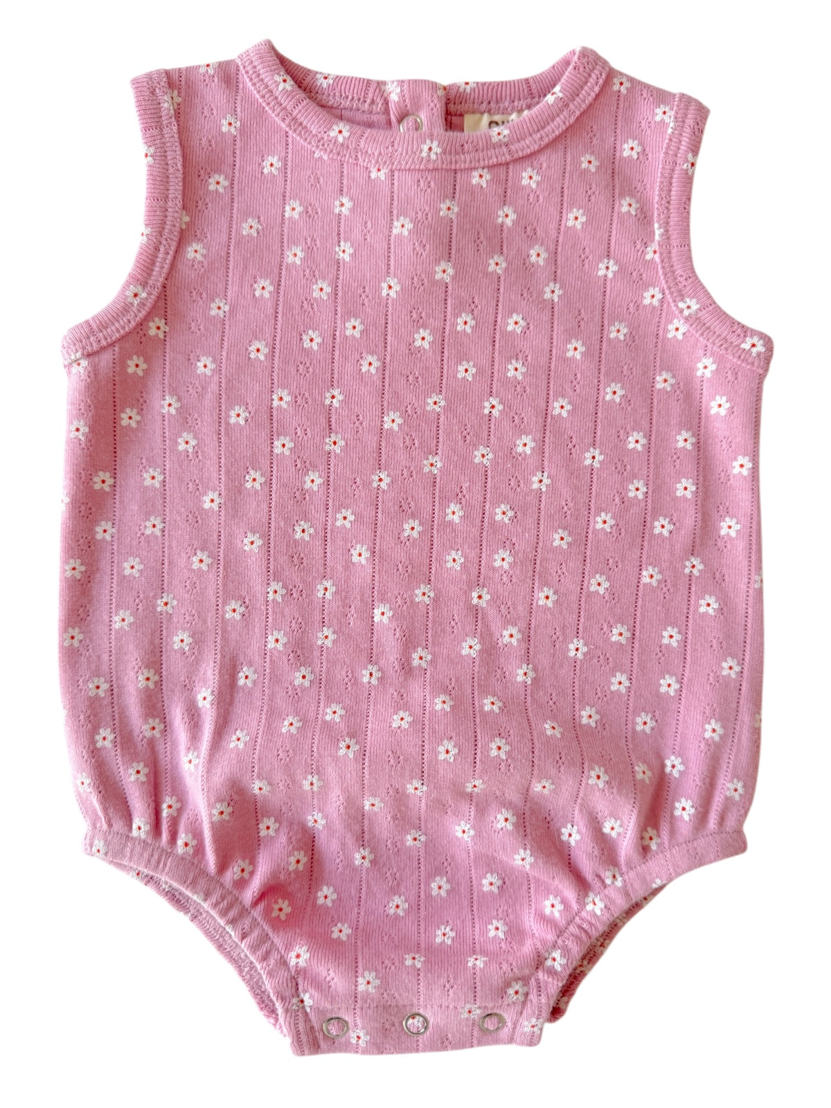 Pink baby bodysuit with floral pattern and snap closures at the bottom.