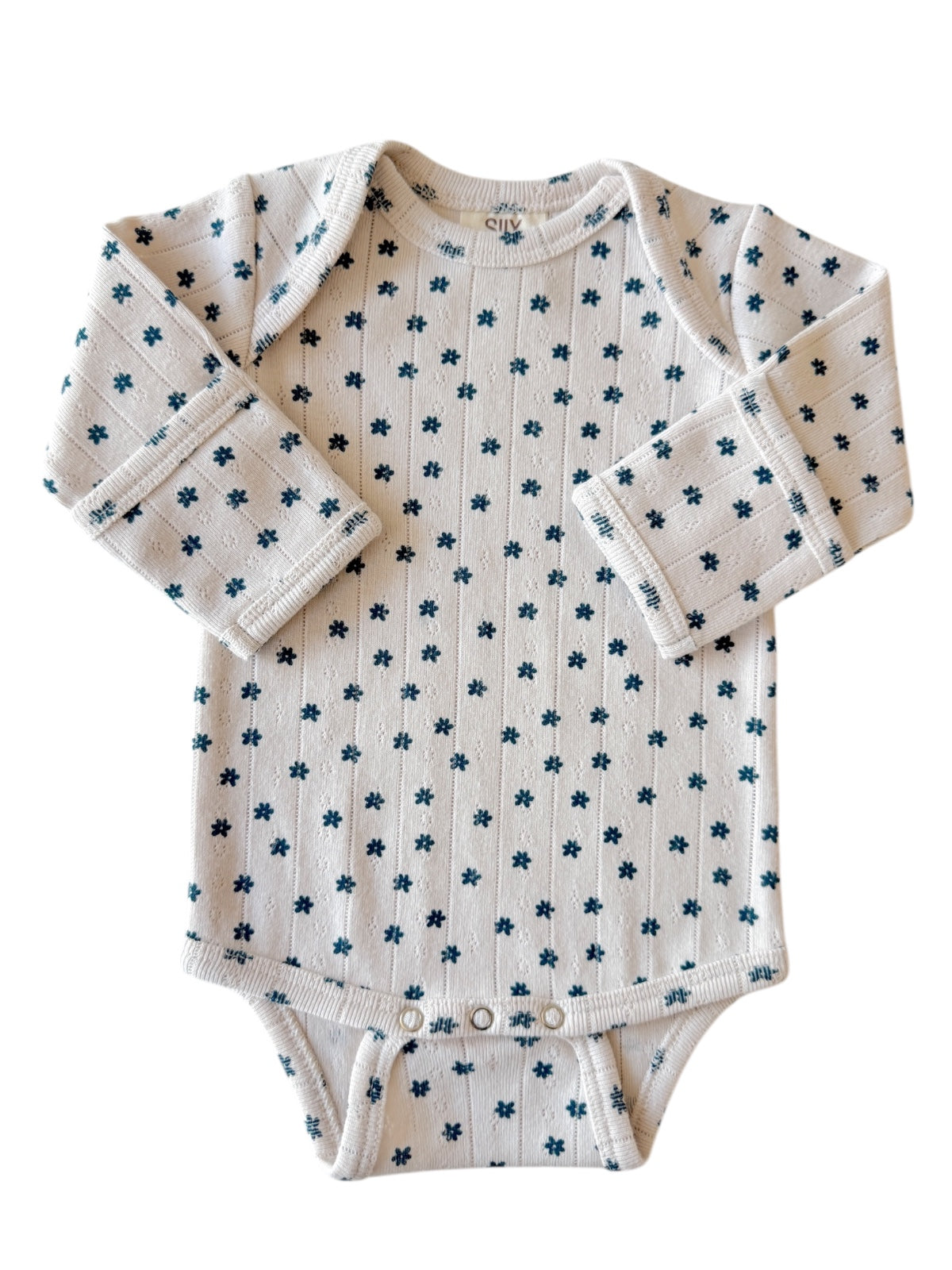 Long-sleeve baby onesie with a floral pattern on a light background. Suitable for toddlers.