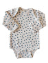 Long-sleeve baby onesie with a floral pattern on a light background. Suitable for toddlers.