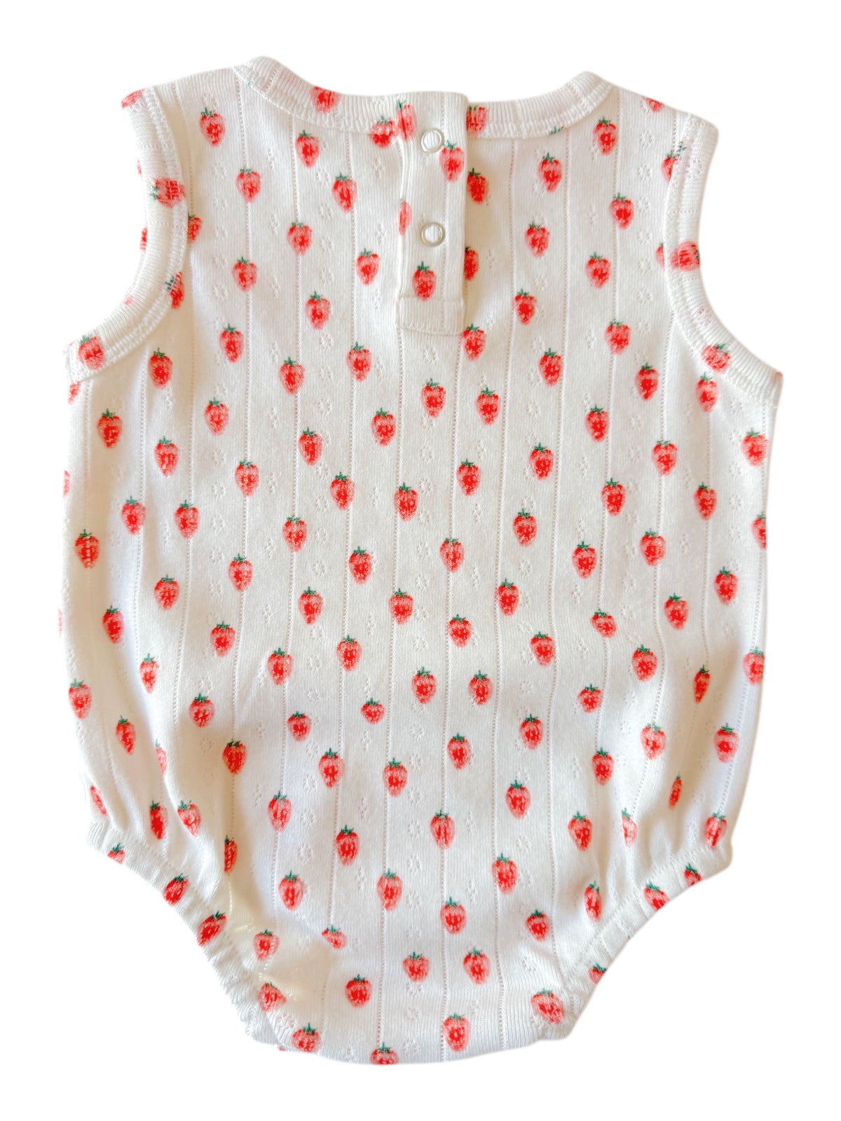 White baby romper with red strawberry pattern and snaps at the back. Ideal for warm weather.