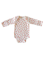 White baby onesie with red strawberry print and long sleeves. Ideal for infants and toddlers.