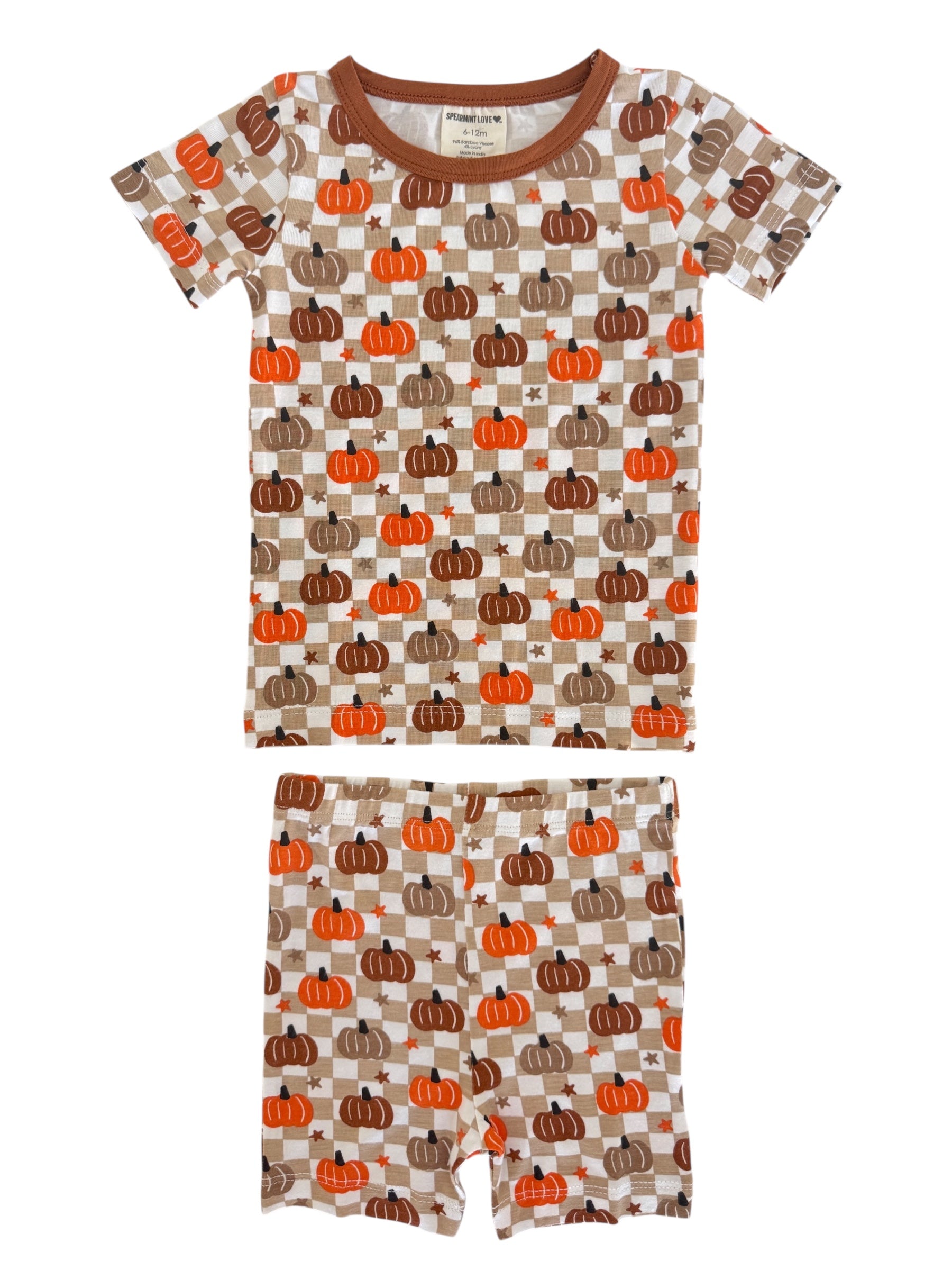 Brown and orange children's pajamas with pumpkin patterns, featuring a short-sleeve shirt and matching shorts.