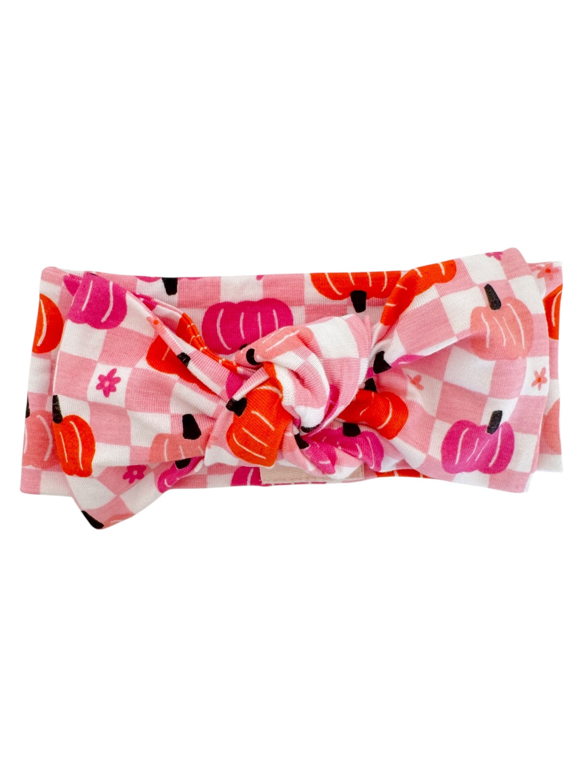Pink checkered headband featuring colorful pumpkin prints and a knot detail in the center.