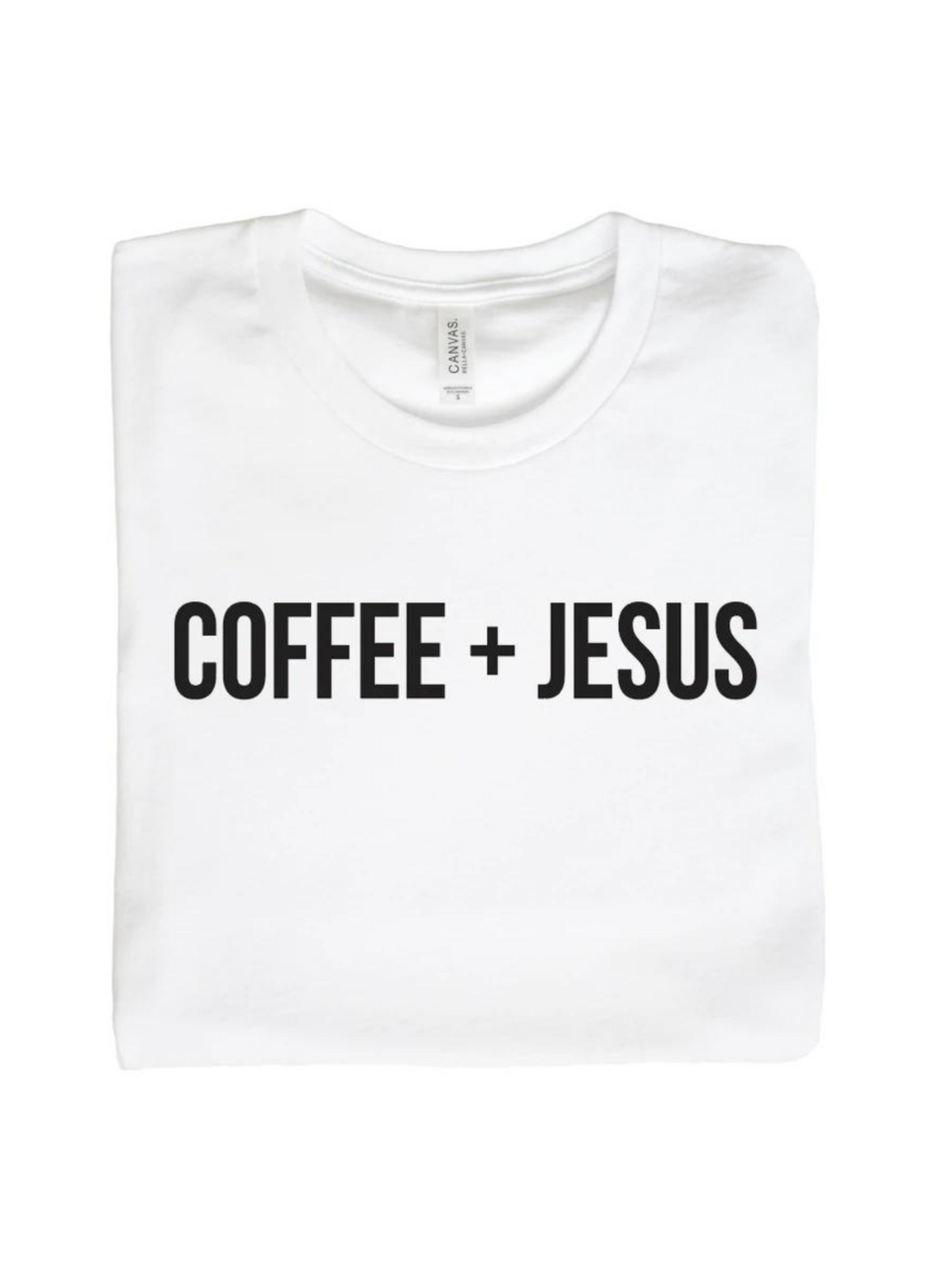 White t-shirt folded, featuring the text "COFFEE + JESUS" in bold black letters.