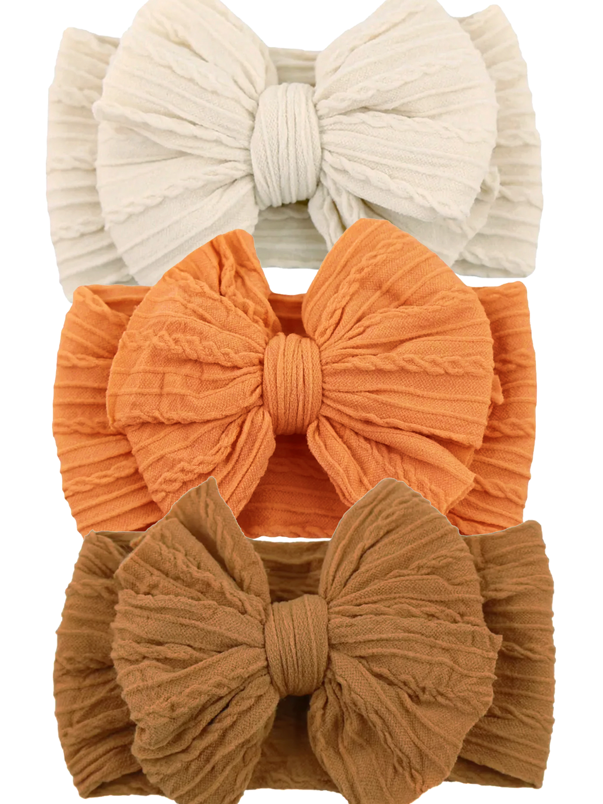 Three fabric hairbands in cream, orange, and brown, featuring large textured bows.