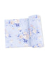Floral fabric in soft blue with roses and leaves, rolled and flat for display. Ideal for sewing projects and crafts.
