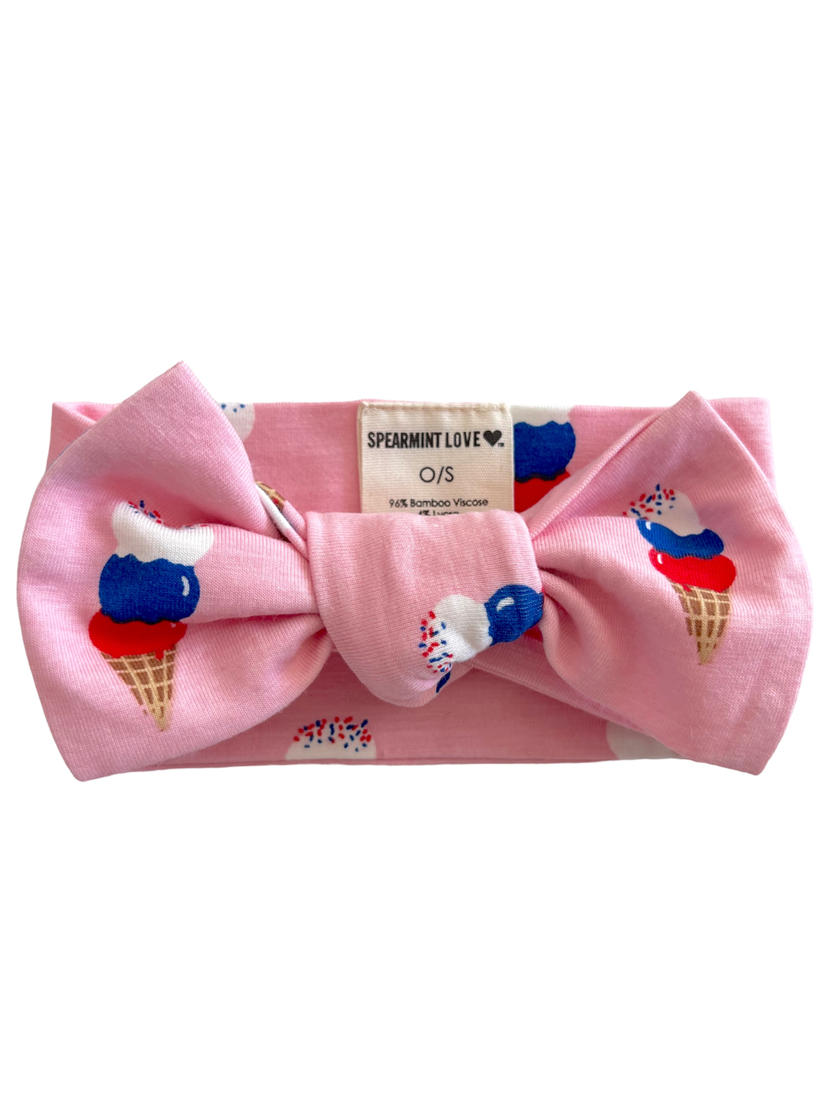 Pink headband with a large bow, featuring a colorful ice cream cone print and a tag that reads "SPEARMINT LOVE."