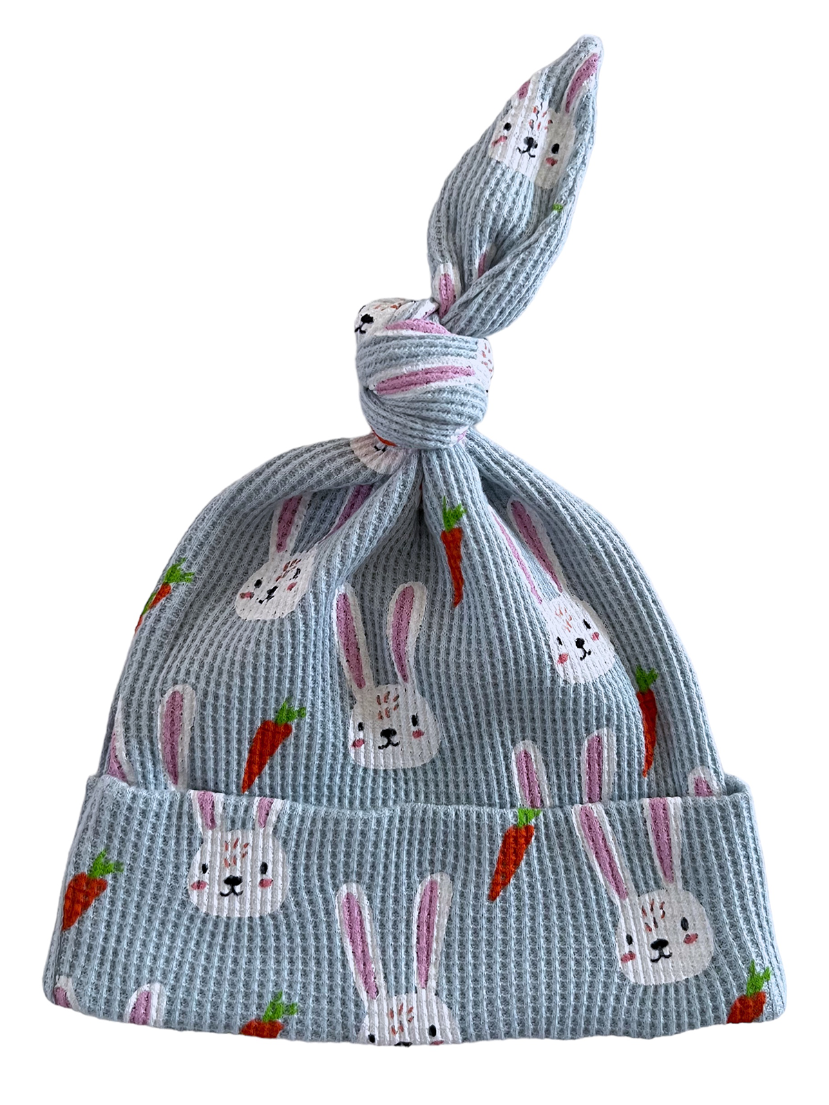 Light blue baby hat with bunny and carrot print, featuring a knotted top design.