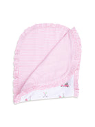 Pink ruffled blanket with striped pattern on one side and playful golf-themed print on the other side.