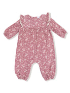 Floral baby romper in pink with ruffled sleeves and elastic cuffs, ideal for comfort and style.