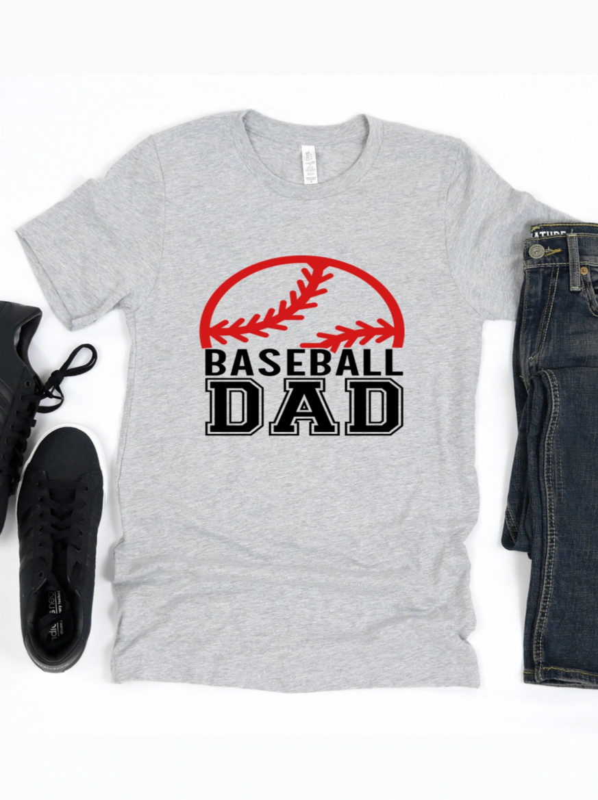 Gray t-shirt with "BASEBALL DAD" text and baseball graphic, paired with jeans and black sneakers.