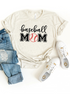 Baseball mom graphic t-shirt styled with jeans and white shoes on a light background.