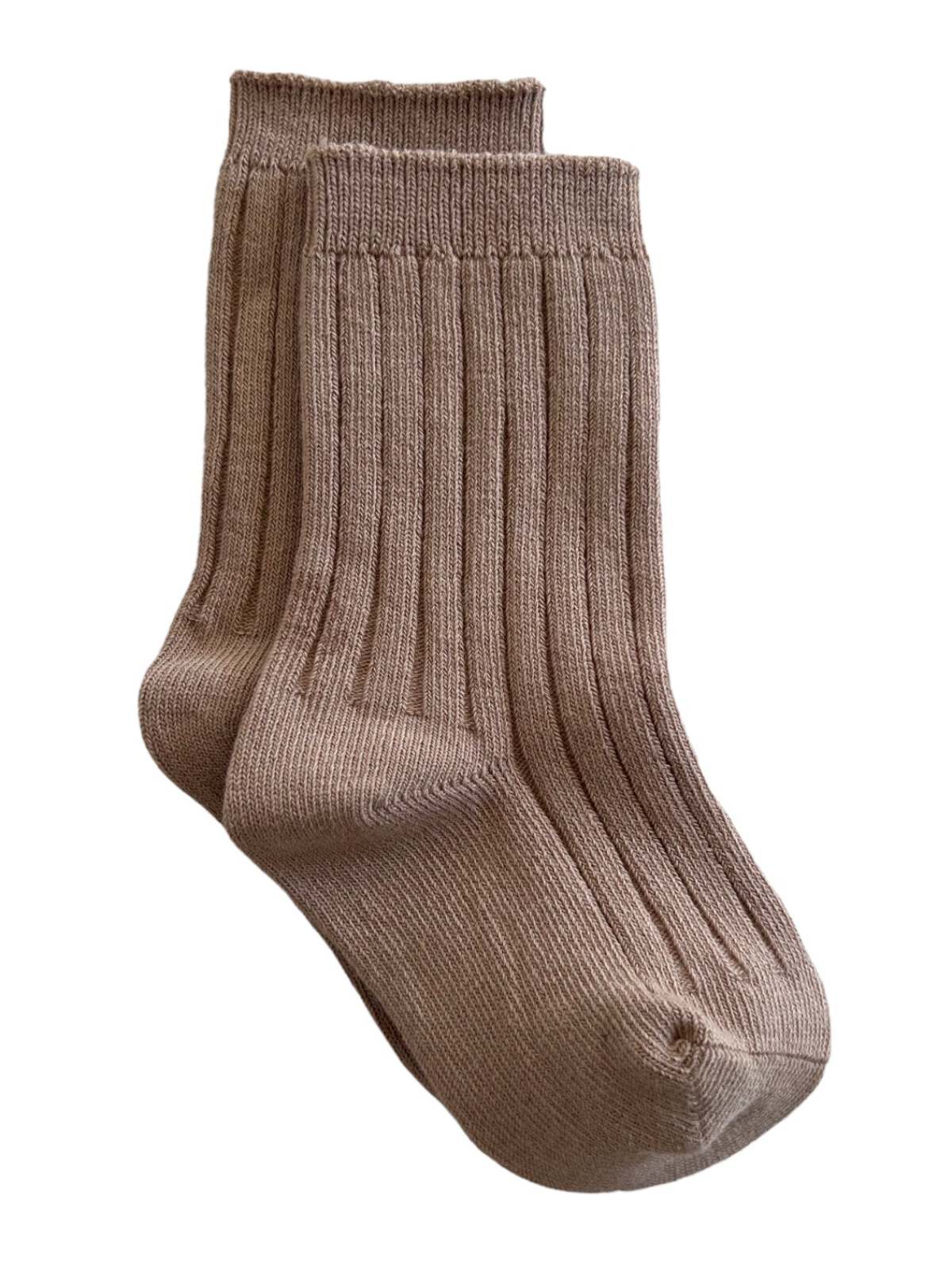 Pair of ribbed brown socks laid flat on a white background.
