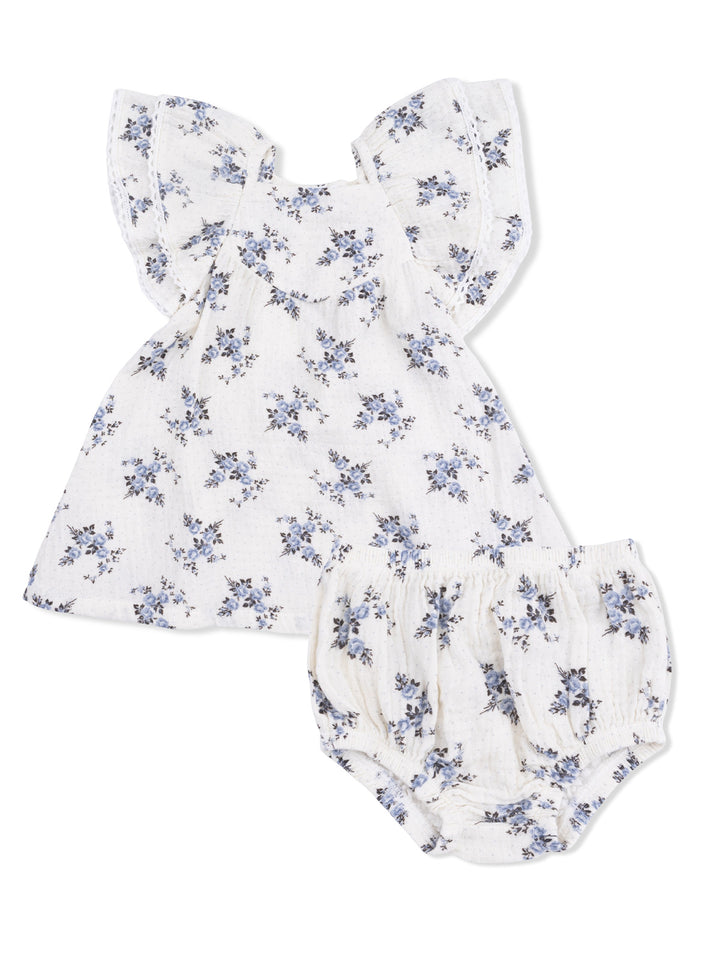 Floral baby outfit with a ruffled top and bloomer shorts in white and blue shades.