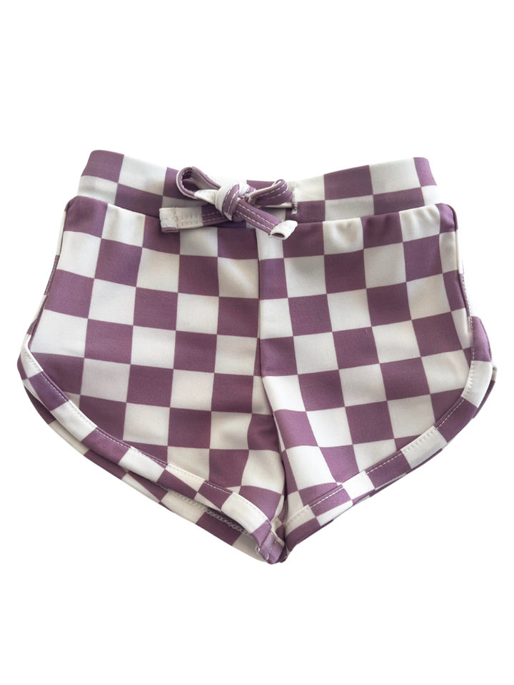 Purple and white checkered shorts with a front bow detail. Perfect for casual summer wear.