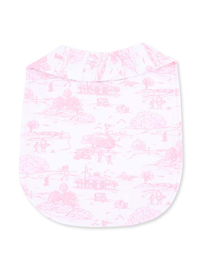 Pink patterned fabric featuring a scenic design with outdoor motifs. Ideal for apparel or home décor.