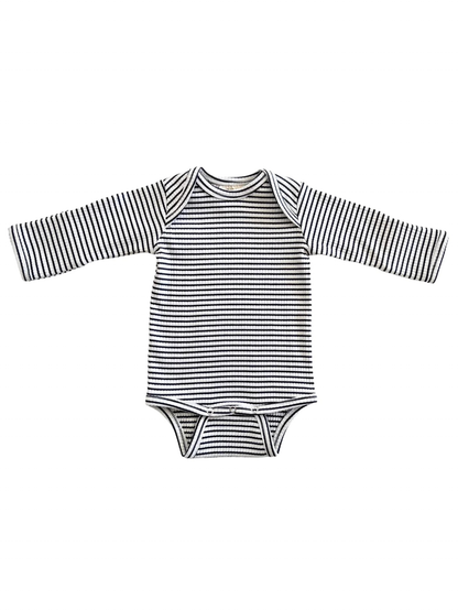 Black and white striped long-sleeve baby bodysuit on a white background.