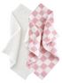 Two textured towels: one white and one pink checkered, overlapping slightly.