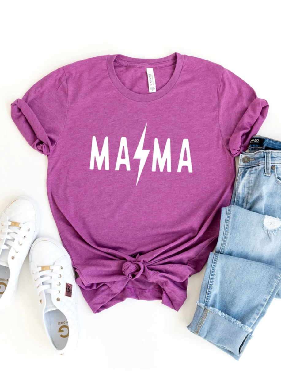 Purple t-shirt with "MAMA" in white, paired with light jeans and white sneakers on a white background.