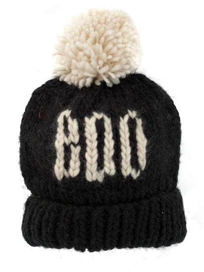 Black knitted hat with white pom-pom, featuring the number "800" in a decorative stitched design.