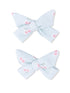 Light blue striped hair bows with pink cherry patterns, arranged in a pair.