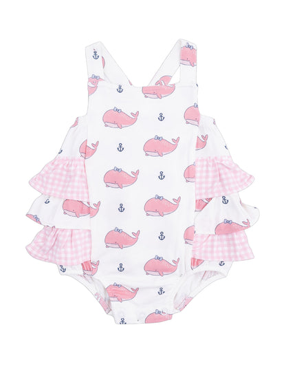 Pink whale-patterned girls' swimsuit with ruffled pink gingham sleeves and white background. Ideal for summer fun.