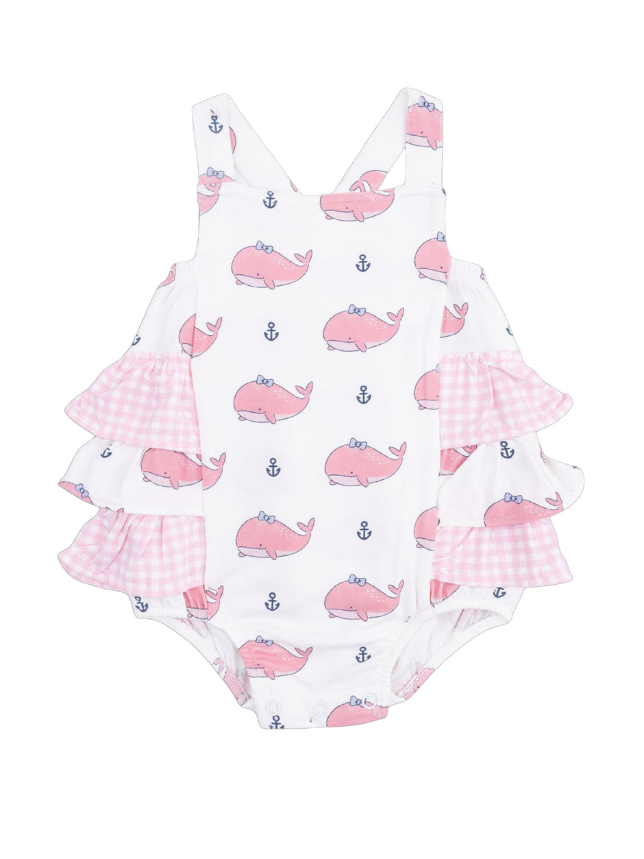 Pink whale-patterned girls' swimsuit with ruffled pink gingham sleeves and white background. Ideal for summer fun.
