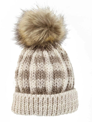 Knitted beanie hat with a faux fur pom-pom, featuring a striped pattern in beige and cream colors.