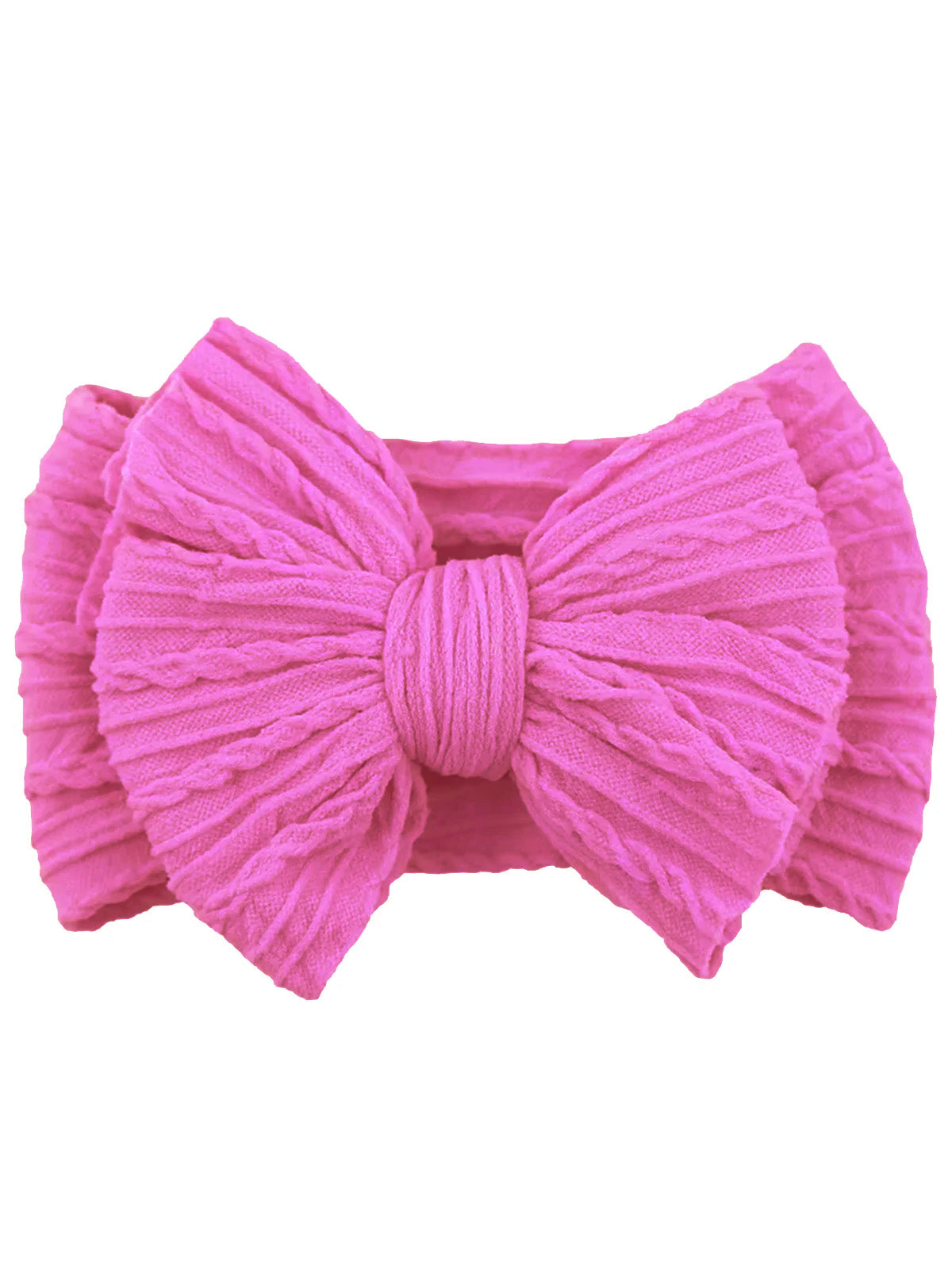 Pink textured fabric bow hair accessory on a flat surface.