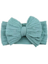 Light blue textured headband with a large bow detail at the front. Perfect for stylish hair accessories.