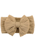 Light beige fabric headband with a large textured bow in the center. Perfect for stylish hairdos.