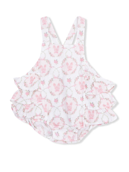 White baby romper with pink bunny pattern and frilled layers, ideal for spring or summer wear.