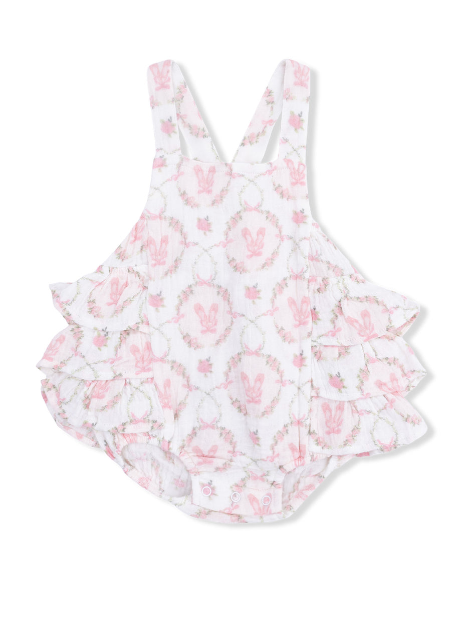 White baby romper with pink bunny pattern and frilled layers, ideal for spring or summer wear.