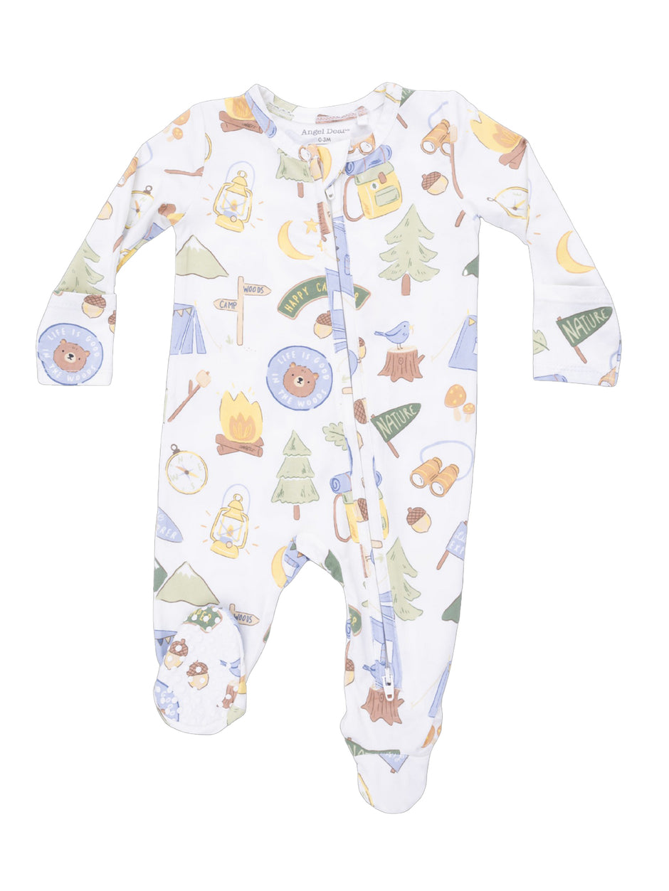 White baby onesie featuring a camping theme with bears, trees, tents, and outdoor icons, zip-up front design.