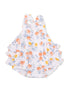 White baby romper with orange and yellow floral design and ruffled layers on the sides.
