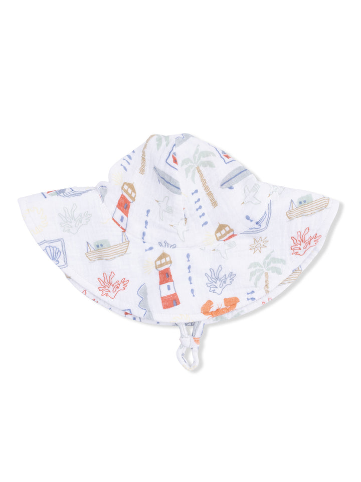 White sun hat with colorful nautical patterns, including boats, lighthouses, and sea life, designed for children.