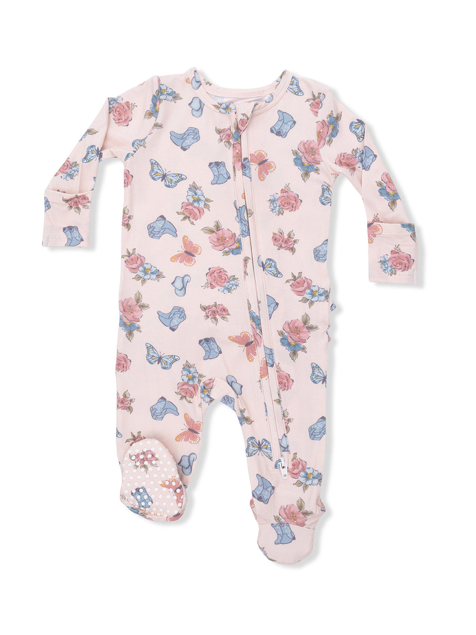Pink baby onesie with floral and butterfly pattern, featuring long sleeves and footed design.